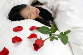 roses placed on the bed for a romantic touch
